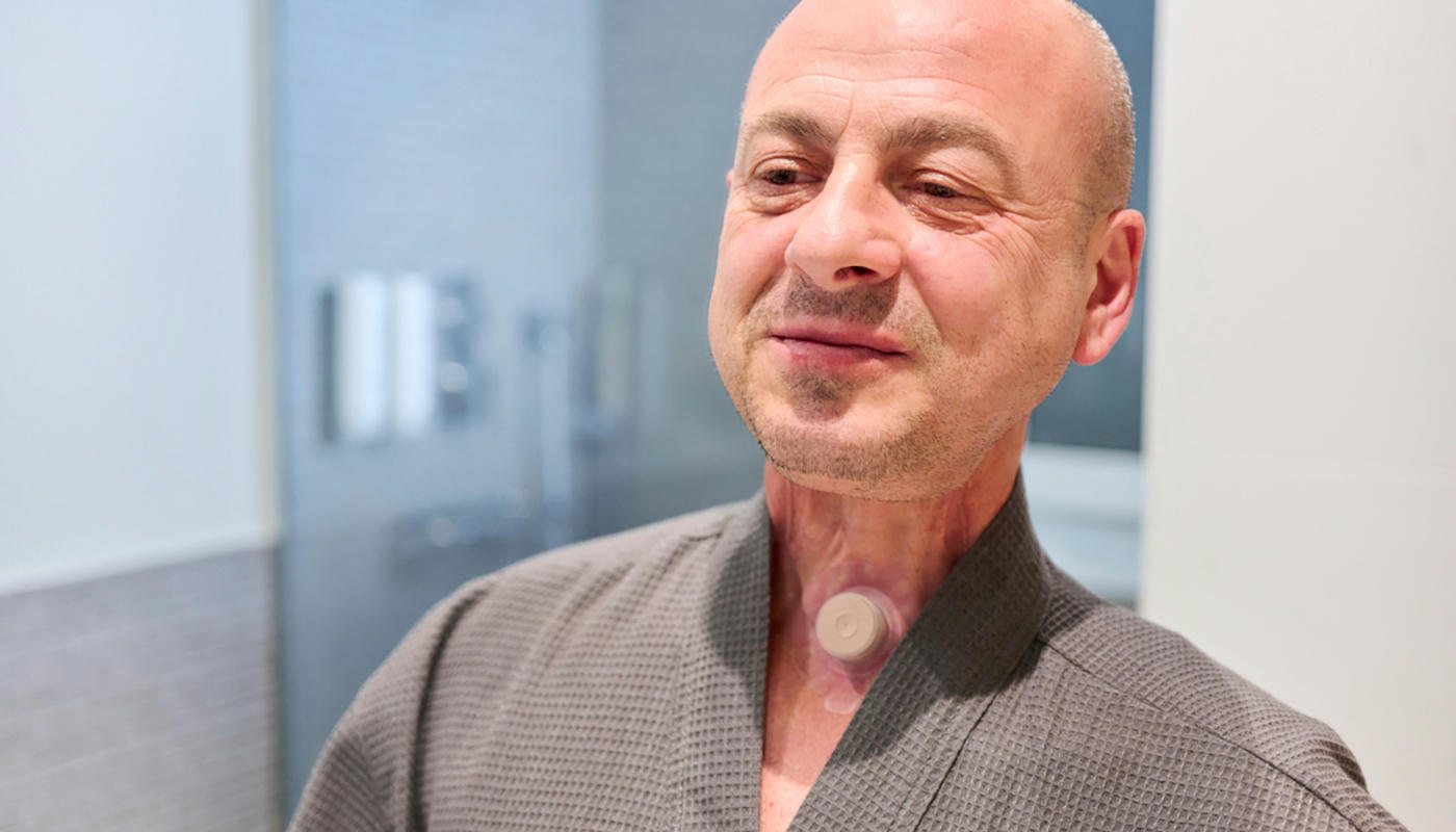 Man with stoma maintenance living with laryngectomy